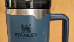 Blue 40 oz Stanley Cup Showing Chipping Along the Top Edge