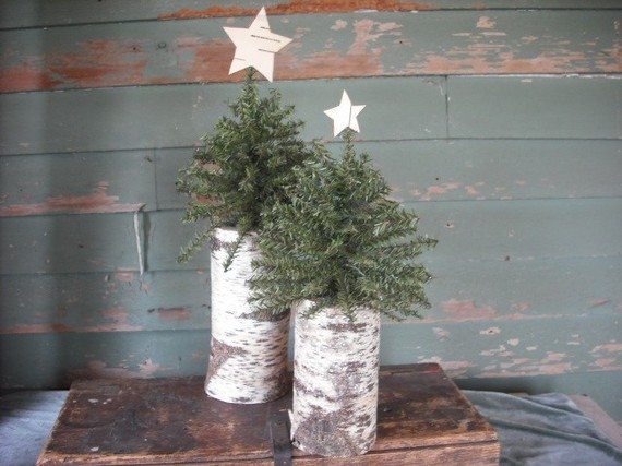 Woodland Christmas trees on birch logs with birch bark star