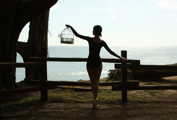 Ballerina Holding a Bird Cage