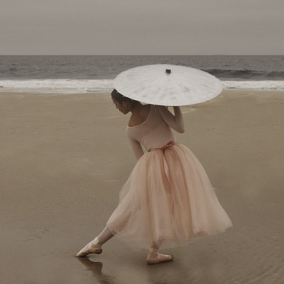 Ballerina dancing with Umbrella on Beach