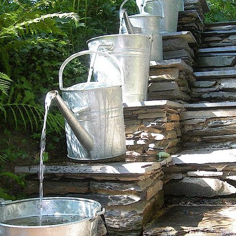 diy old water can ideas
